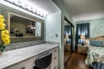 large mosaic mirror, makeup area, mirrored closet, master bedroom